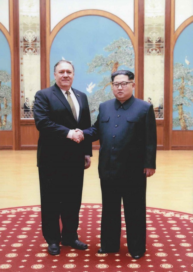 This undated photo, released by the White House, shows US Secretary of State Mike Pompeo (L) and North Korean leader Kim Jong-un meeting in Pyongyang over Easter weekend. (Yonhap)
