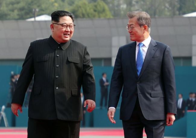 South Korean President Moon Jae-in (R) and North Korean leader Kim Jong-un (L) walk together at the Joint Security Area (JSA) on the Demilitarized Zone (DMZ) in the border village of Panmunjom in Paju, South Korea, 27 April 2018. South Korean President Moon Jae-in and North Korean leader Kim Jong-un are meeting at the Peace House in Panmunjom for an inter-Korean summit. The event marks the first time a North Korean leader has crossed the border into South Korea sine the end of hostilities during the Korean War. EPA/KOREA SUMMIT PRESS POOL / POOL (Yonhap)