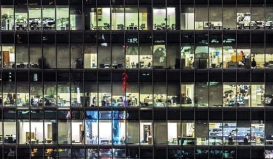 Lights remain on at an office building in Seoul with workers still inside on a late evening in this photo from the Korea Chamber of Commerce and Industry. (Yonhap)