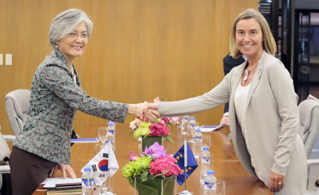 South Korean Foreign Minister Kang Kyung-wha (left) and Federica Mogherini, the European Union’s high representative for foreign affairs and security policy, shake hands before a meeting in Manila in August last year.