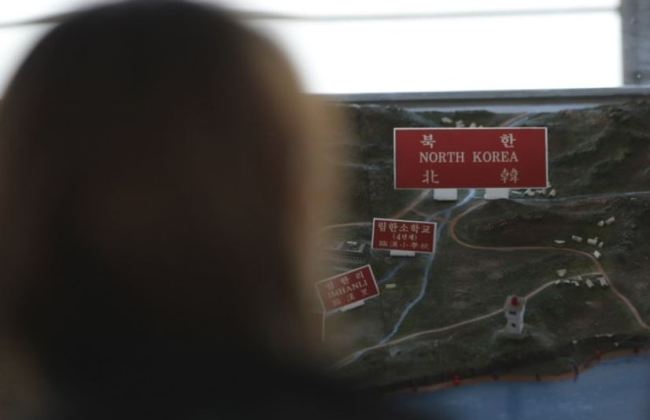 A visitor looks at a map of North Korean towns at the unification observatory in Paju, South Korea, Tuesday, Nov. 14, 2017. (AP)