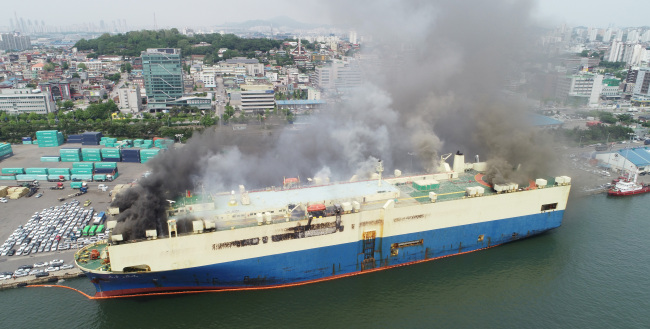 A big fire takes place on a Panama-registered car carrier at the port of Incheon on May 21, 2018. (Yonhap)