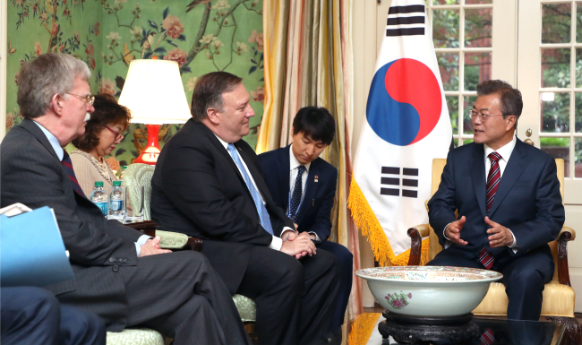 President Moon Jae-in speaks with US Secretary of State Mike Pompeo and National Security Advisor John Bolton in Washington DC on Tuesday. Yonhap