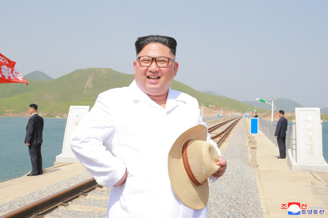 North Korean leader Kim Jong-un inspects the newly completed Koam-Tapchon Railways in the country's border province of Kangwon in this photo released by the North's Korean Central News Agency on Friday. (Yonhap)