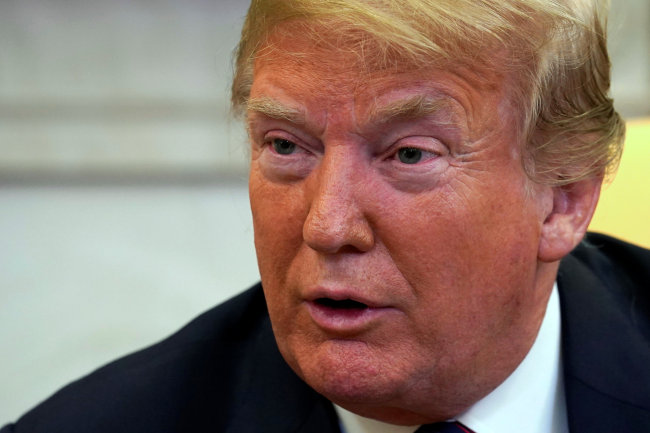 US President Donald Trump talks to the media in the Oval Office of the White House in Washington, US, May 26. (Reuters)