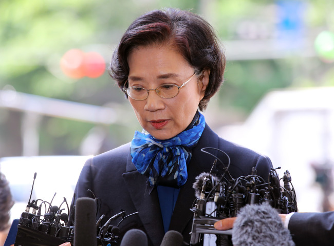 Lee Myung-hee, wife of Hanjin Group Chairman Cho Yang-ho, answers reporters' questions over multiple assault allegations as she appeared for police questioning in Seoul on May 28, 2018. (Yonhap)