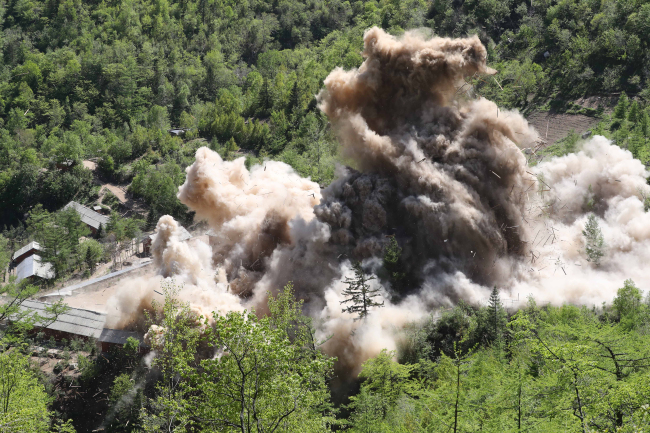 This pool photo shows the demolition of North Korea's Punggye-ri nuclear test site on May 24, 2018. (Yonhap)