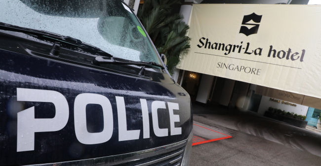 A police car is parked in front of the Shangri-La Hotel on Thursday. (Yonhap)