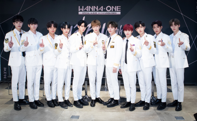 Wanna One poses during a press conference for its new EP “1÷x=1 (Undivided)” in Seoul on Sunday. (CJ E&M)