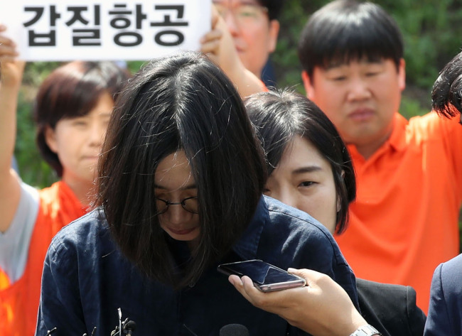 Cho Hyun-ah, a former vice president of Korean Air Lines Co., stands before media as she appeared for questioning by the customs office in Incheon, west of Seoul, over smuggling and tax evasion allegations, on June 4, 2018. (Yonhap)