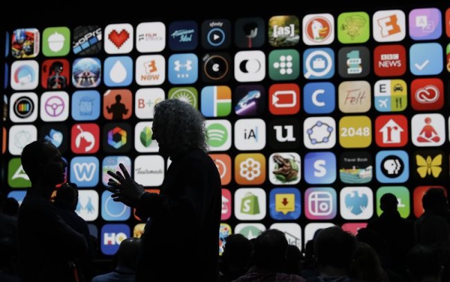 Attendees wait for an announcement of new products at the Apple Worldwide Developers Conference in San Jose, CA, Monday, June 4. (AP)