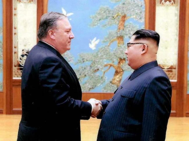 In this image released by the White House, Mike Pompeo shakes hands with North Korean leader Kim Jong Un in Pyongyang, North Korea, during a 2018 trip. (AP)