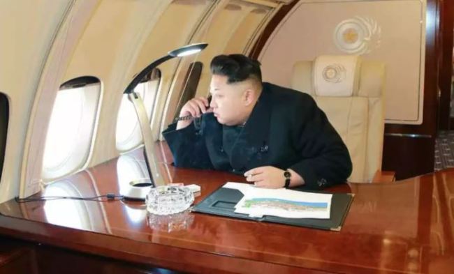 Kim photographed on his remodeled II-62 while flying over Pyongyang to survey a large construction project. (KCNA)