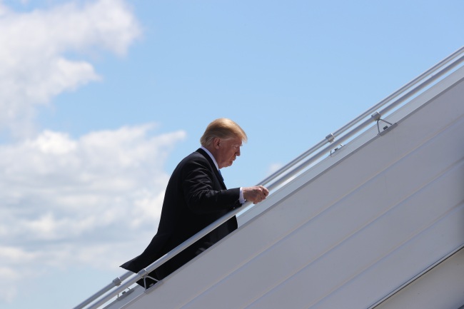 US President Donald Trump boards Air Force One to depart for travel to Singapore from the Canadian Forces Base Bagotville, Quebec, Canada, June 9, 2018. (Reuters)