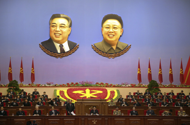 Portraits of late North Korean leaders Kim Il Sung, left, and his son, Kim Jong Il, hang inside the convention hall of the April 25 House of Culture, where the party congress is held in Pyongyang, North Korea. (AP)