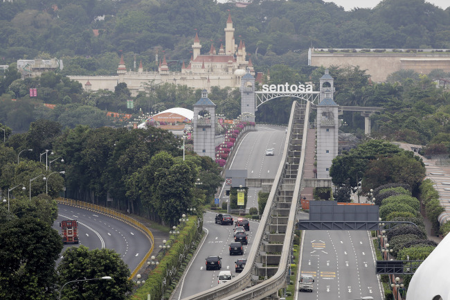 A car carrying United States President Donald Trump enters Sentosa island where the summit between him and North Korean leader Kim Jong Un will take place at the Capella Hotel on Tuesday. (Reuters)