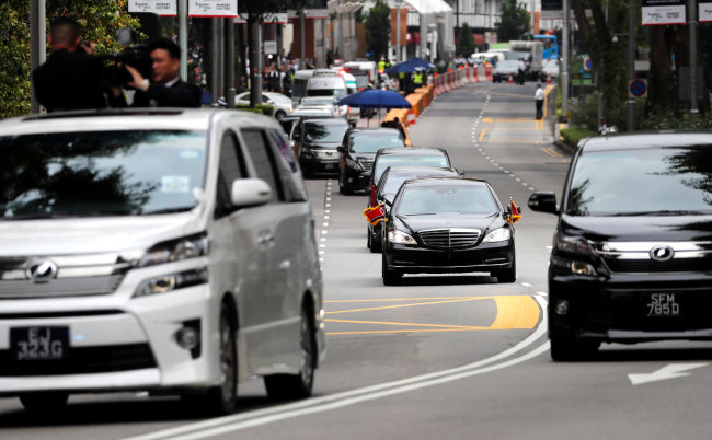 The motorcade of North Korean leader Kim Jong Un travels towards Sentosa for his meeting with US President Donald Trump, in Singapore on Tuesday. (Reuters)