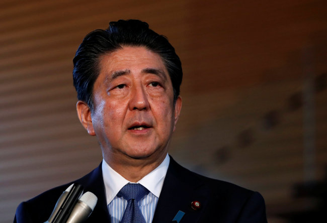 Japan's Prime Minister Shinzo Abe speaks to media after the news conference by the US President Donald Trump, after the summit between the US and North Korea in Singapore, at Abe's official residence in Tokyo, Japan, Tuesday. (Reuters-Yonhap)