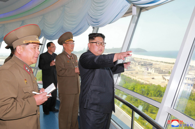 North Korean leader Kim Jong-un tours the construction site for the Kalma coastal tourism zone in Wonsan, Kangwon Province, last month. (Yonhap)