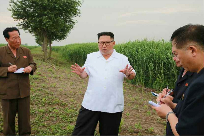 North Korean leader Kim Jong-un inspects a farm in Sindo County in North Pyongan Province. Yonhap