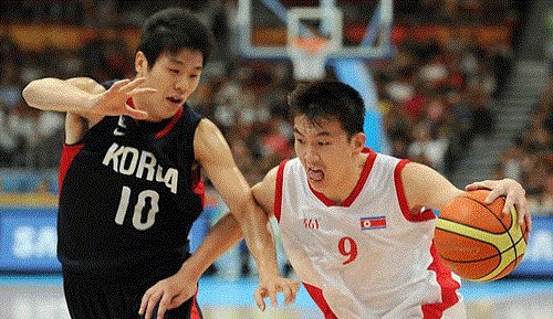 The two Koreas play against each other at the 2010 Asian Games in Guangzhou, China. (Yonhap)