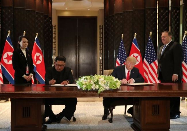 US President Donald Trump and North Korean leader Kim Jong-un signing agreement on June 12 in Singapore. (Reuters)