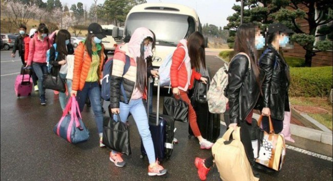 Thirteen DPRK restaurant workers who defected en masse in April 2016. (Yonhap)
