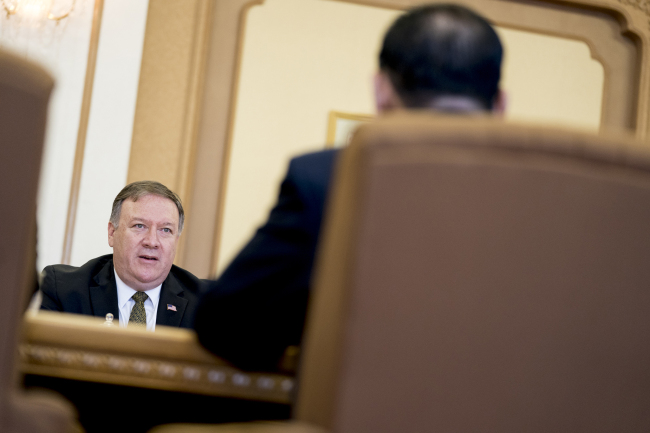 US Secretary of State Mike Pompeo, left, speaks to Kim Yong-chol, foreground, a North Korean senior ruling party official and former intelligence chief. (AP)