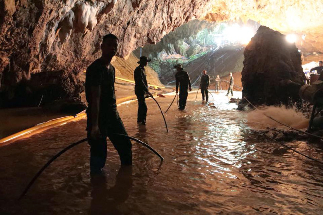 Members of the Royal Thai Navy along with volunteers from England, the United States, Australia, and China, are pictured as they prepare to rescue 12 schoolboys, members of a local soccer team, and their coach, from the Tham Luang Cave network in Northern Thailand. Two British volunteer divers found the missing boys Monday after a nine-day search. (Royal Thai Navy)