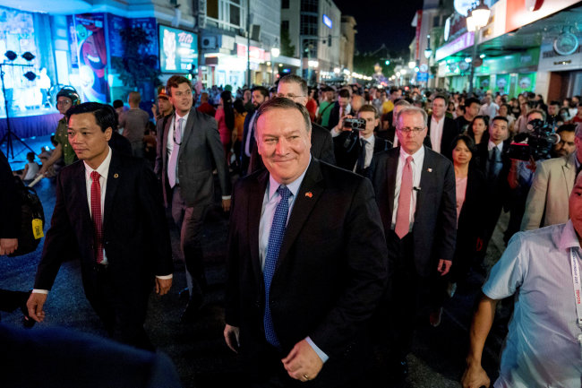 US Secretary of State Mike Pompeo, center, walks through the streets of Hanoi, Vietnam, Sunday, July 8. (AP-Yonhap)