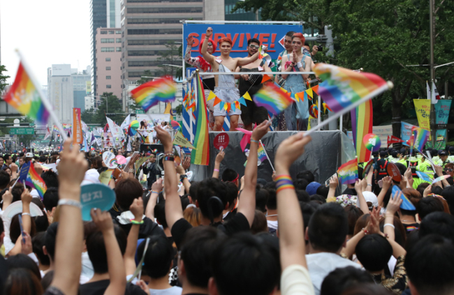 Participants of the Korea Queer Culture Festival march along Sejong-daero Road between Seoul City Hall and Gwanghwamun Square on July 15, 2017. (Yonhap)