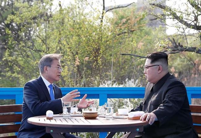 South Korean President Moon Jae-in and North Korean leader Kim Jong-un during their meeting at the truce village of Panmunjeom on April 27. (AP-Yonhap)