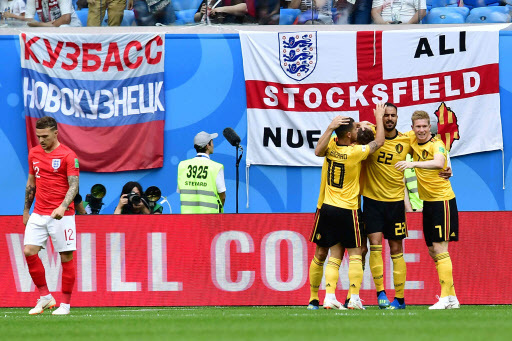 Belgium's players celebrate after scoring the opener during their Russia 2018 World Cup play-off for third place football match between Belgium and England at the Saint Petersburg Stadium in Saint Petersburg on July 14, 2018. / AFP