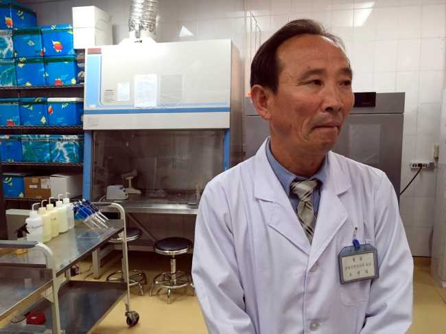 In this May 7, 2018, photo, Doctor O Yong Il explains how patients are diagnosed at the National Tuberculosis Reference Laboratory in Pyongyang, North Korea. Despite a mood of detente following the summit between US President Donald Trump and North Korean leader Kim Jong Un in June, ongoing sanctions are keeping life-saving medicines from North Korean tuberculosis patients and could fan a regional epidemic. (AP)