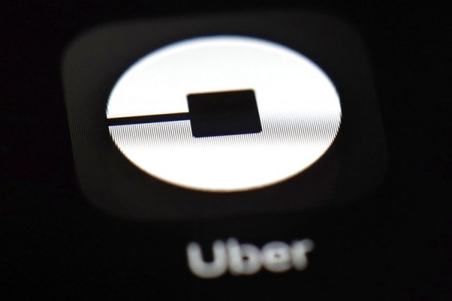 This March 20 file photo shows the Uber app on an iPad in Baltimore. (AP)