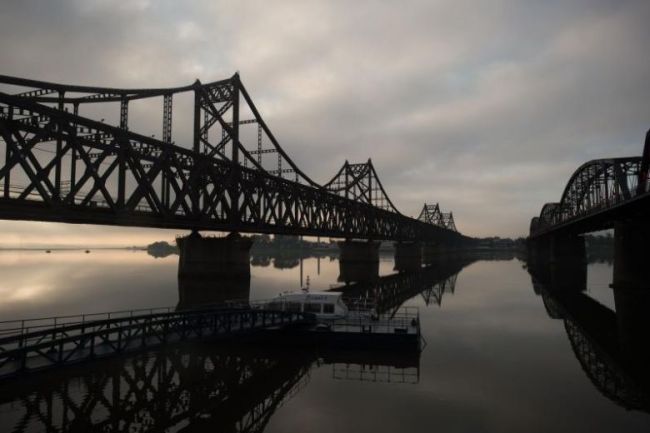 The Friendship bridge connecting the North Korean town of Sinuiju and the Chinese border city of Dandong. Trucks ply the bridge to bring goods from China into North Korea. (AFP)