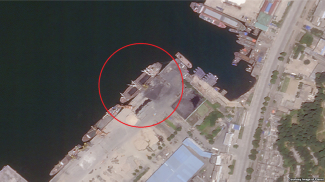 A ship is seen docked next to a crane for loading coal at a port in North Korea's Wonsan, Gangwon Province. Yonhap