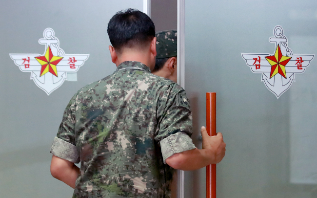 A military official enters the office of the military’s special investigation team at the Ministry of National Defense in Seoul on Monday. Yonhap