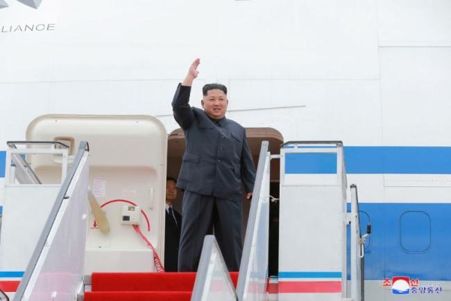 In a file photo, North Korea's leader Kim Jong-un waves before departing Pyongyang to Singapore on June 10. (KCNA-Reuters)