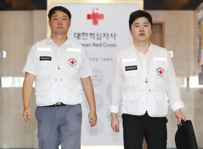 In this photo taken Aug. 4, 2018, officials from the Korean Red Cross leave for the border village of Panmunjom to exchange the final lists of separated families selected to join planned family reunions later this month with their North Korean counterparts. (Yonhap)