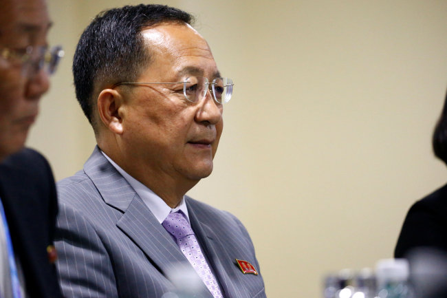 North Korea's Foreign Minister Ri Yong Ho attend a bilateral meeting with China's Foreign Minister Wang Yi on the sidelines of the ASEAN Foreign Ministers' Meeting in Singapore, August 3, 2018. (Yonhap)