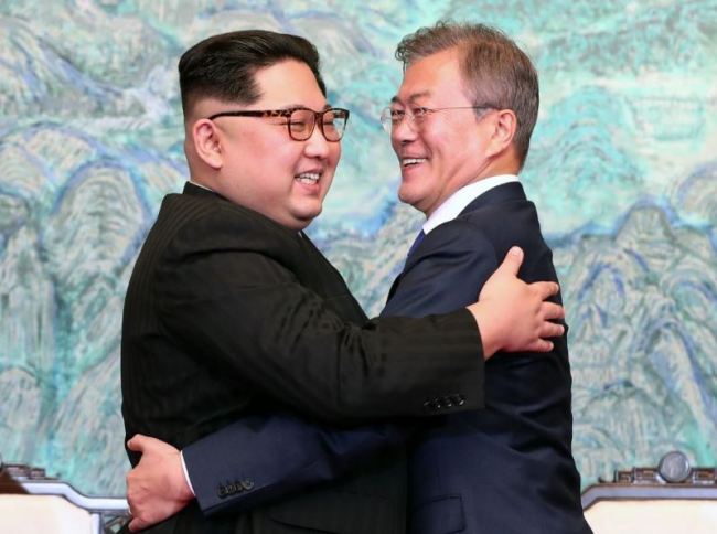 North Korean leader Kim Jong-un, left, and South Korean President Moon Jae-in hug after signing on a joint statement on April 27 at the border village of Panmunjom in the Demilitarized Zone, South Korea. (AP)