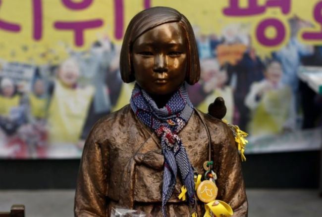 A 'comfort women' statue in front of the Japanese embassy in Seoul. (Reuters)