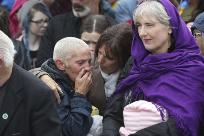 People gather to protest at the site of the former Tuam home for unmarried mothers in County Galway, during the visit to Ireland by Pope Francis, Sunday, Aug. 26. (AP)