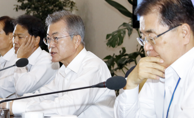 President Moon Jae-in holds a meeting with his senior aides at the presidential office on Monday. Yonhap