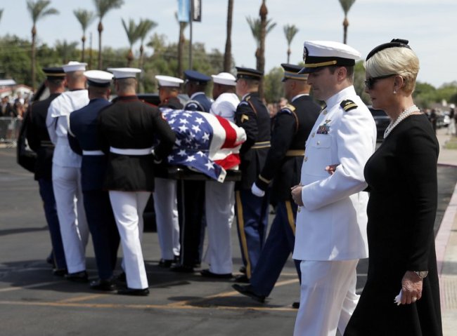 Cindy McCain walks with her son Jack as the honor guard carries the casket after a memorial service for Sen. John McCain, R-Ariz. at the North Phoenix Baptist Church on Thursday, Aug. 30, in Phoenix. (AP)