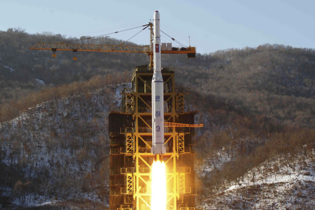 Footage from the KCNA news agency shows the Unha-3 rocket launching at North Korea's West Sea Satellite Launch Site in 2012. (Yonhap)
