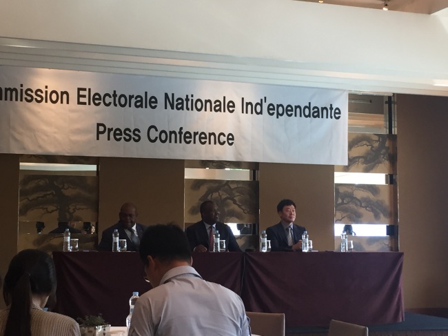 Corneille Nangaa, the head of the electoral commission of the Democratic Republic of Congo (center) speaks during a press conference in Seoul, Tuesday. (Claire Lee/ The Korea Herald)