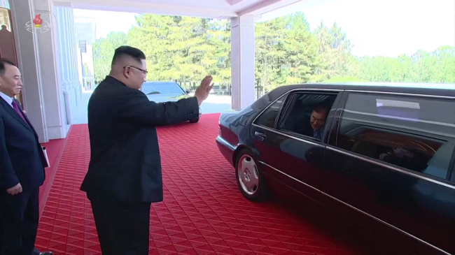 North Korea's leader Kim Jong-un sees off the South Korean delegates. Yonhap