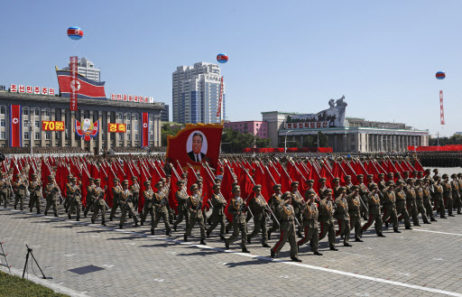 North Korean soldiers march with a float showing late North Korean leader Kim Il Sung during a parade for the 70th anniversary of North Korea's founding day in Pyongyang, North Korea, Sunday, Sept. 9, 2018. North Korea staged a major military parade, huge rallies and will revive its iconic mass games on Sunday to mark its 70th anniversary as a nation. (AP)
